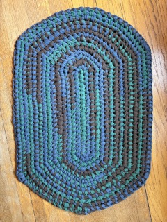 Green, blue and brown knotted rug